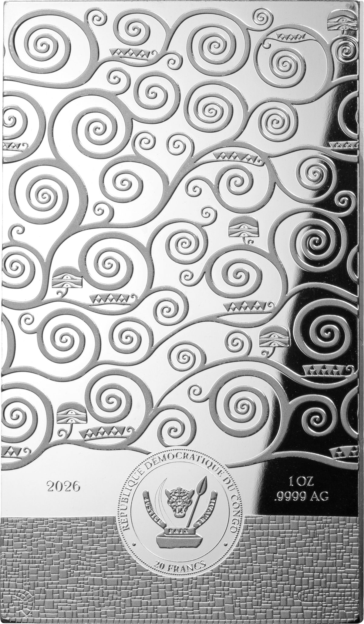 A silver-colored decorative plaque or coin featuring an embossed swirling tree-like pattern, with small tree silhouettes and the text '2026' and '1 oz .9999 AG' visible on a textured lower section.
