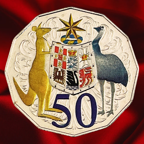 Reverse, main view: Australia 2012 hyper-metallic 50-cent coin with coloured kangaroo, emu, Coat of Arms shield and purple denomination on red satin.