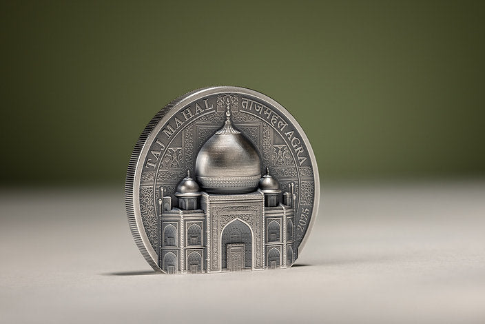 Left-angled view of the freestanding Taj Mahal silver coin, showing its reeded edge, domed relief and intricate entrance.