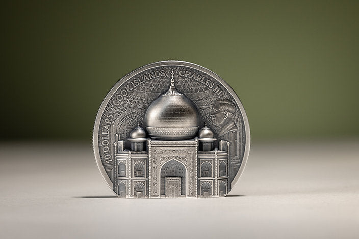 Freestanding Taj Mahal silver coin obverse, showing King Charles III and the raised architectural design against a softly blurred green background.