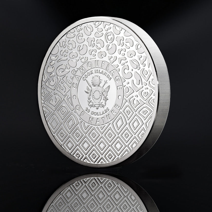 Cook Islands Tiger coin obverse with the coat of arms, 20 Dollars inscription and geometric camouflage pattern.