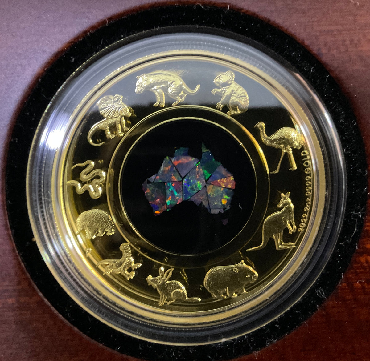 Australia 2022 $200 Great Southern Land 2oz Gold Proof Opal Coin. Opal in different lightng.