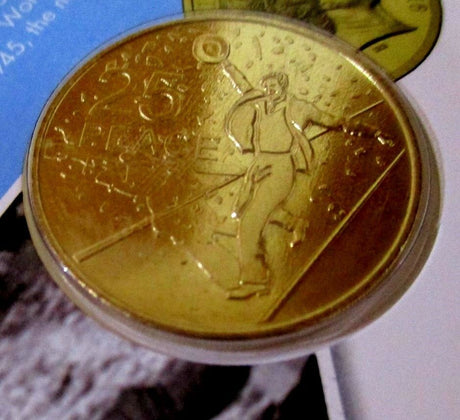 A 2016 Australia 25 Cent uncirculated coin with an image of a dancing man, placed on a blue background.