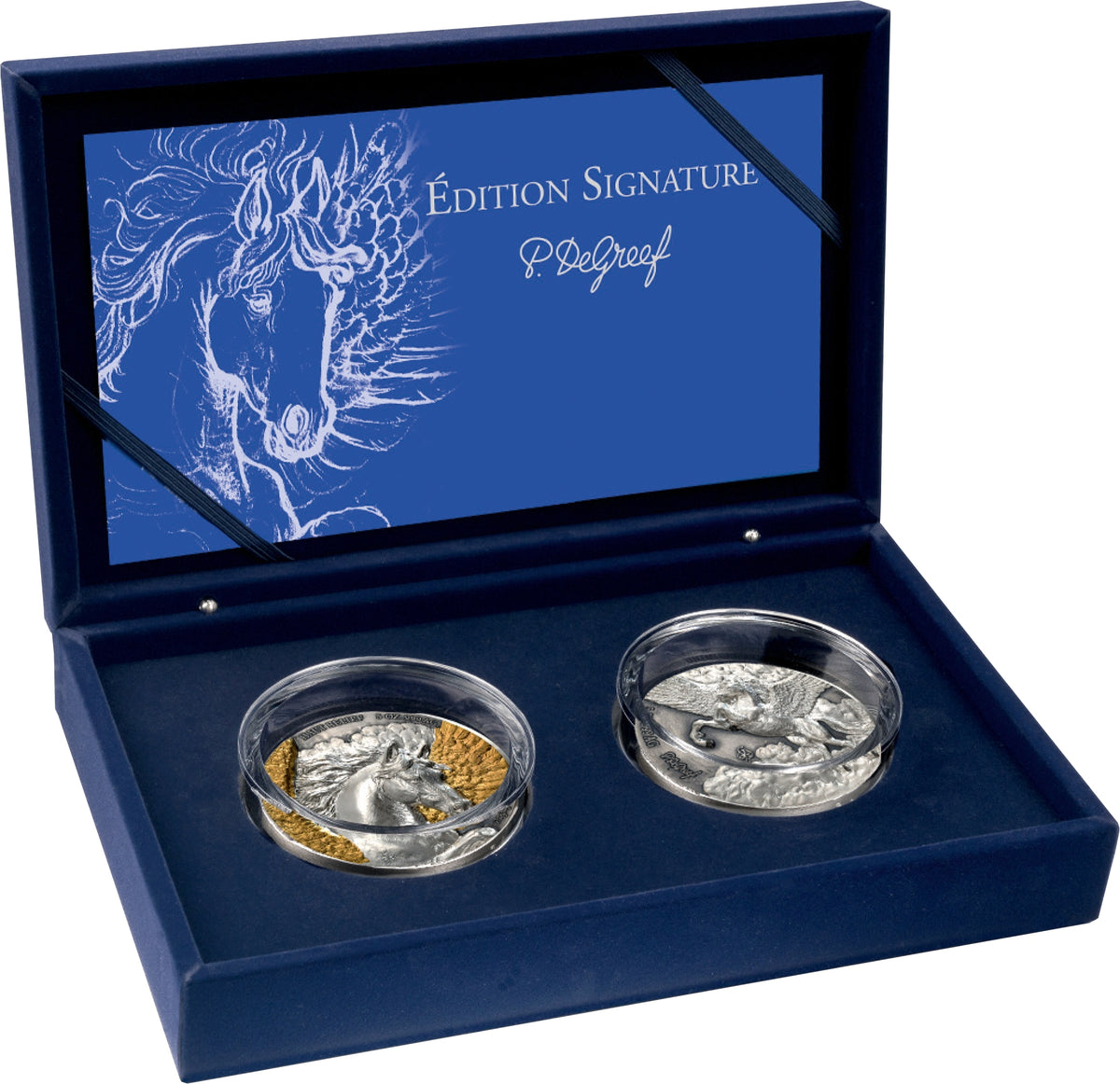 A P. DelGroef 'Edizione Signature' coin set in an open dark blue presentation box.