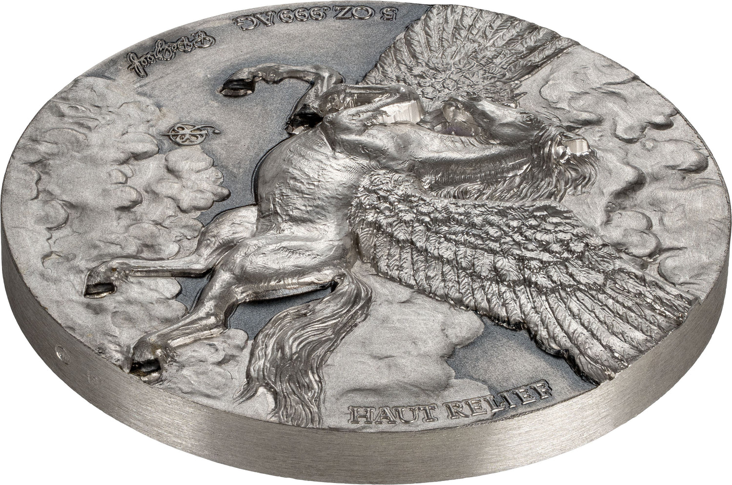 A circular silver-toned relief plaque featuring a detailed sculpted winged horse figure with clouds and engraved text, shown on a plain white background.