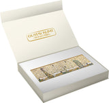 An open white Gustav Klimt 'Stocklet Fries' gift box displaying a rectangular gold-toned decorative piece featuring an Art Nouveau scene with trees and figures.