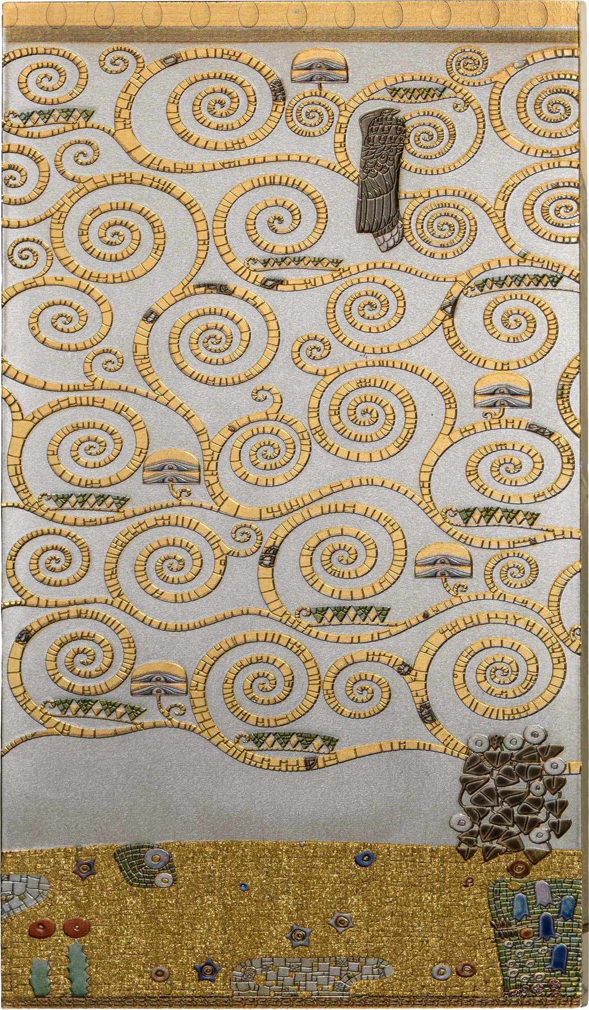 A square textile or rug featuring an abstract, decorative pattern of many gold spirals and loops on a light gray background, with small multicolored details and a gold border along the bottom.