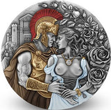 Decorative coin featuring a Roman soldier and woman with roses and classical architecture.