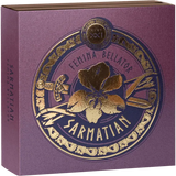 Sarmatian Femina Bellator packaging box in textured purple with gold foil detailing, featuring a central circular emblem with a flower, sword, and decorative border.