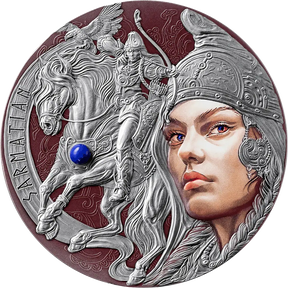 A circular silver-toned medallion or coin featuring a sculpted warrior on a horse with a winged motif, alongside a large stylized female face in profile. The design includes embossed details, engraved text along the left edge, and a small blue gemstone accent on the horse.
