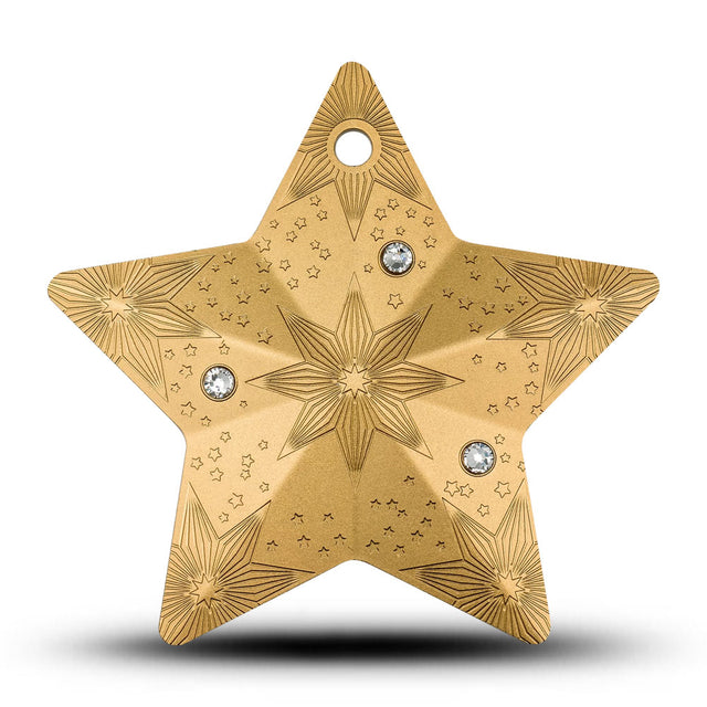 Gold star-shaped decorative item with star patterns and embedded crystals on a white background