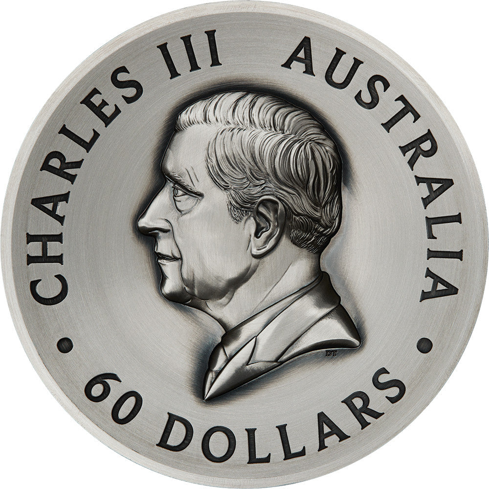 Silver coin with a portrait of Charles III and text 'Charles III Australia 60 Dollars'.