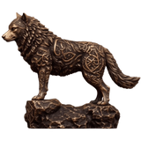 Side view of the antiqued Celtic Wolf copper statue, showing textured fur, Celtic knotwork and a rocky base.