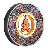 Australia 2026 Gingerbread Christmas silver coin, featuring a coloured gingerbread village and dangling enamelled gingerbread man in its open centre.