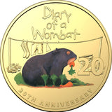 Gold coin with a wombat illustration and text 'Diary of a Wombat' and '20th Anniversary'.