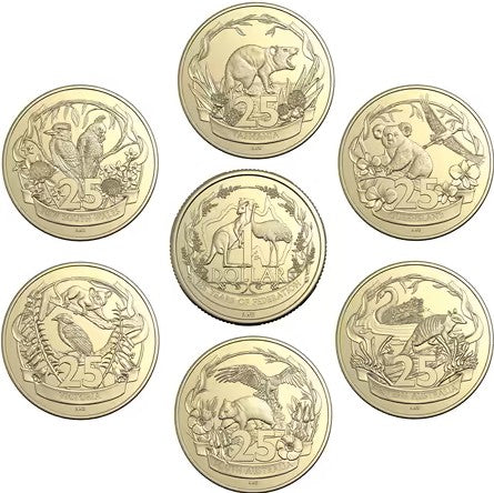 Set of gold coins with various designs on a white background