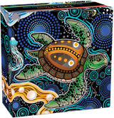 A square decorative box featuring a colorful Aboriginal-style illustration of a sea turtle surrounded by blue dots, green patterns, and orange accents on a black background.