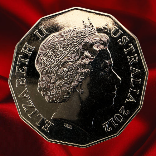 Obverse, dark reflection: Australia 2012 50-cent coin with Queen Elizabeth II portrait and inscriptions against a dark reflective field.