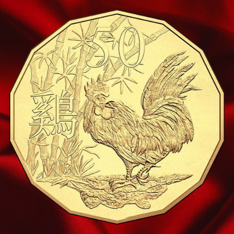 Reverse, new main image: Australia 2017 WMF gold-plated Rooster 50-cent coin showing detailed plumage, bamboo, Chinese character and 50 denomination on red satin.