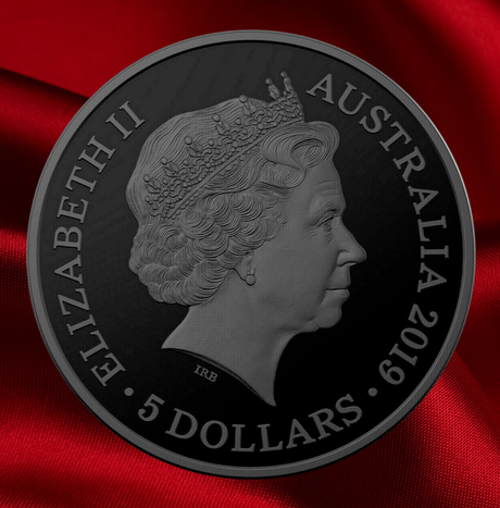 A matte black Australian 5-dollar coin featuring a profile portrait of Queen Elizabeth II, with 'ELIZABETH II AUSTRALIA 2019 5 DOLLARS' inscribed around the edge, set against a draped red fabric background.