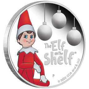 The Elf on the Shelf 2022 silver proof coin reverse, showing a red-suited Scout Elf, hanging baubles and The Perth Mint’s P mintmark.