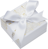 White Christmas Nutcracker gift box with gold decorative detailing and a large white ribbon bow