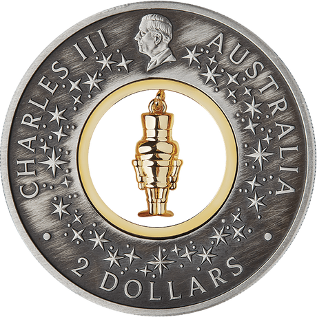 King Charles III obverse of the Australian two dollar Nutcracker coin, with stars and a gold-plated figurine insert