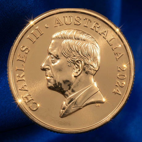 Obverse, blue satin: Australia 2024 Bluey $1 coin featuring King Charles III’s portrait, with Charles III, Australia and 2024 inscriptions, on blue satin.