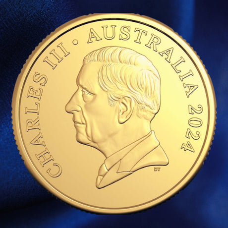Obverse, alternate view: Australia 2024 Bluey $1 Dollarbuck coin obverse showing King Charles III’s portrait and the year 2024, against blue satin.