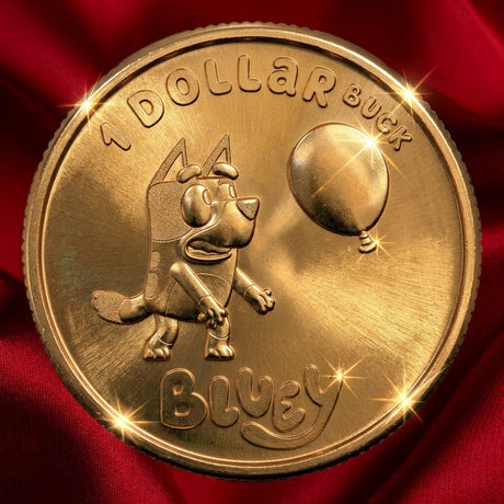 Reverse, red satin: Australia 2024 Bluey $1 Dollarbuck coin showing Bluey beside a balloon, with Dollarbuck and Bluey lettering, on red satin.