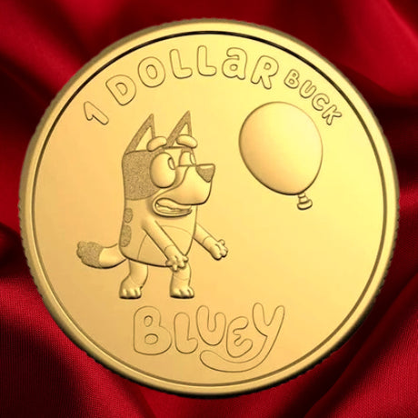 Reverse: Australian $1 Bluey Dollarbuck coin showing Bluey beside a balloon, against a red satin background