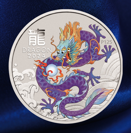 A round silver commemorative coin featuring a detailed purple and blue dragon with orange flames and a pearl, with the text 'DRAGON 2024' and 'P125', set against a dark blue textured background.