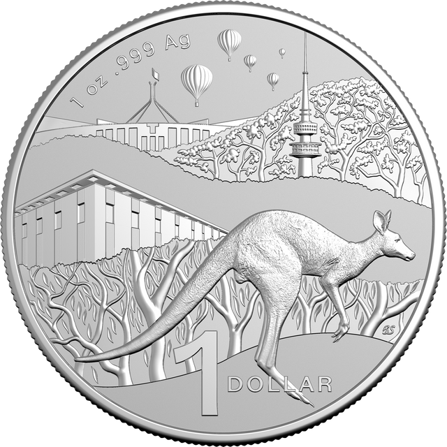 Silver coin with kangaroo design and scenic background