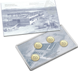 A set of four collectible coins with a depiction of a mint press on the reverse, accompanied by a card with a minting machine image.