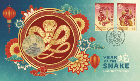 A colorful collectible stamp and coin cover featuring the Year of the Snake design, with floral patterns and snake illustrations.