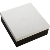 White jewelry box with a black base on a white background
