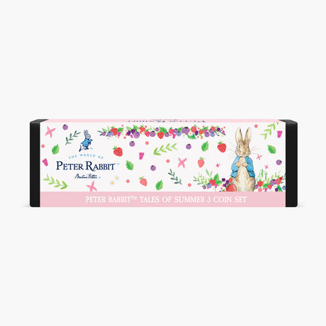 Peter Rabbit Tales of Summer 3 Coin Set in a decorative pink and white illustrated box with watercolor-style drawings of Peter Rabbit, strawberries, flowers, and leaves.