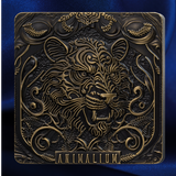 A square decorative plaque or box cover featuring an ornate embossed lion head in metallic gold against a dark bronze background, with the word 'ANIMALIUM' at the bottom, set against a blue fabric backdrop.