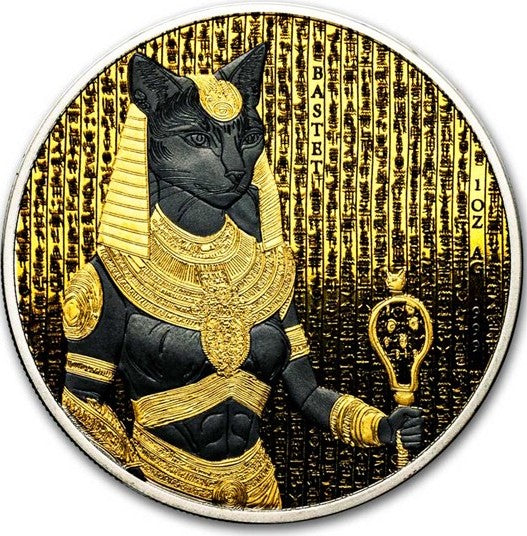  coin featuring an Egyptian cat deity in gold and black attire with hieroglyphs