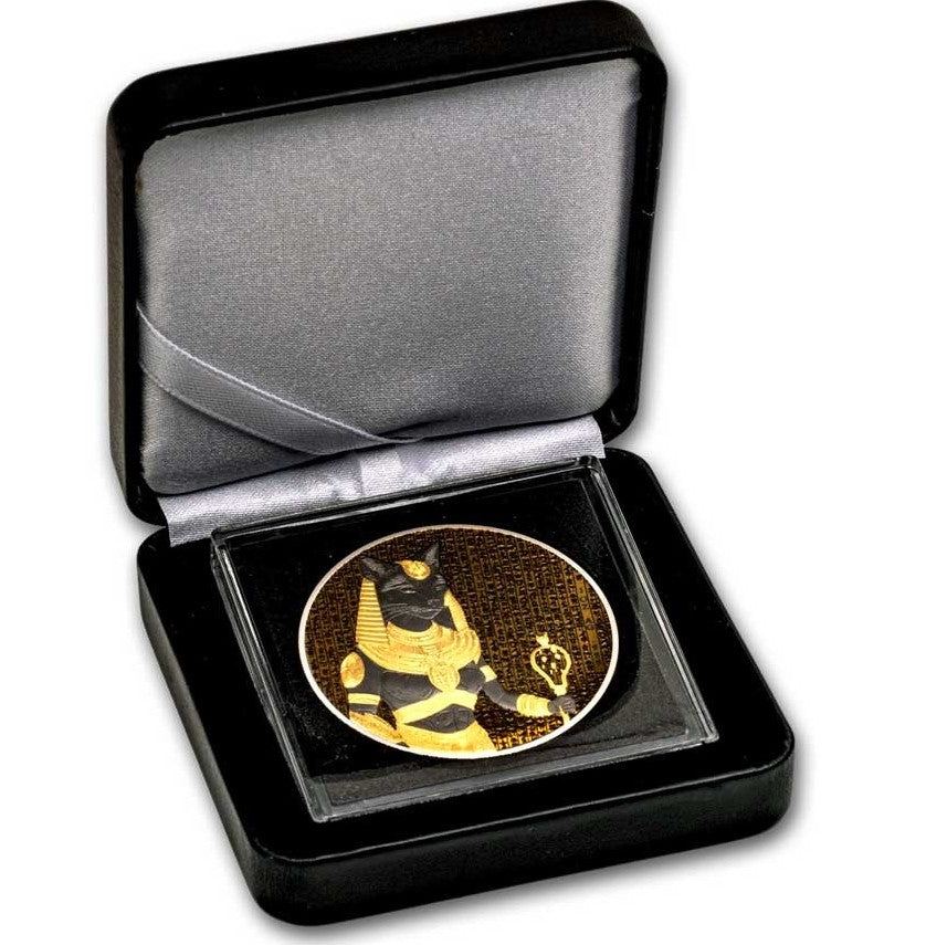 Decorative coin with a design in a black box on a white background