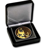 Decorative coin with a design in a black box on a white background