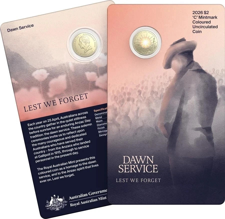 Two carded coins with a commemorative message and coin design on a white background