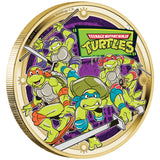 Gold-colored coin with Teenage Mutant Ninja Turtles design on a purple background