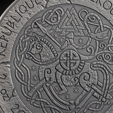 Close-up of Leif Eriksson coin obverse showing interlaced Norse animals and triangular knotwork