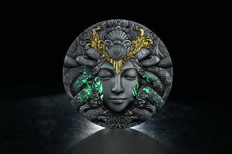 Decorative headpiece with face, green accents, and 'Naga' text on a dark background