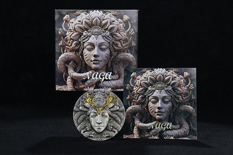 Three decorative head sculptures with 'Naga' inscribed on a dark background