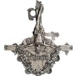 A silver coin with a detailed relief showing the crucifixion of St. Peter, surrounded by ornate designs, with the inscription 'ST.