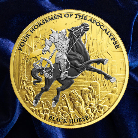 A round gold-toned collectible coin featuring an embossed fantasy scene of a knight on a rearing black horse, with the text 'FOUR HORSEMEN OF THE APOCALYPSE' around the edge and 'BLACK HORSE' at the bottom, displayed on a dark blue satin fabric background.