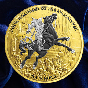 A round gold-toned commemorative coin featuring a detailed relief of a knight on a rearing black horse, with the text 'FOUR HORSEMEN OF THE APOCALYPSE' around the edge and 'BLACK HORSE' at the bottom, displayed against a dark blue satin background.