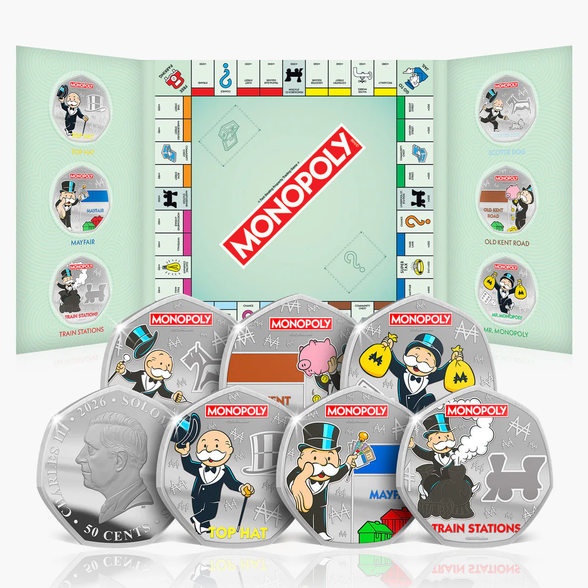 Monopoly-themed silver coins with game board design in the background